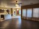 Kitchen with island, dark cabinets, and hardwood floors at 11432 E Quicksilver Ave, Mesa, AZ 85212