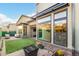 Private backyard with artificial turf and patio at 12411 E Troon Vista Dr, Scottsdale, AZ 85255