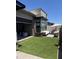 Backyard with artificial turf, patio, dining area and desert landscaping at 12411 E Troon Vista Dr, Scottsdale, AZ 85255