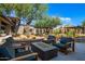 Outdoor seating area with fire pit and mountain views at 12411 E Troon Vista Dr, Scottsdale, AZ 85255