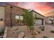 Modern home exterior showcasing stone and desert landscaping at 12411 E Troon Vista Dr, Scottsdale, AZ 85255