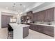 Modern kitchen with gray cabinets, white countertops and island at 12411 E Troon Vista Dr, Scottsdale, AZ 85255