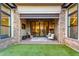 Covered patio with seating and a view of the backyard at 12411 E Troon Vista Dr, Scottsdale, AZ 85255