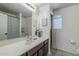 Bathroom with single vanity and shower/tub combo at 1253 E Debbie Dr, San Tan Valley, AZ 85140