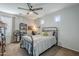 Bright bedroom with striped bedding and built-in shelving at 1253 E Debbie Dr, San Tan Valley, AZ 85140