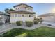 Two-story house with well-manicured lawn and shrubbery at 1253 E Debbie Dr, San Tan Valley, AZ 85140