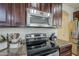 Close up of kitchen stove and microwave at 1253 E Debbie Dr, San Tan Valley, AZ 85140