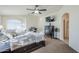 Main bedroom with a king-size bed and a ceiling fan at 1253 E Debbie Dr, San Tan Valley, AZ 85140