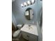 Updated bathroom with vanity and oval mirror at 13428 N 36Th Pl, Phoenix, AZ 85032