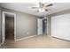 Bright bedroom with double door closet and ceiling fan at 13428 N 36Th Pl, Phoenix, AZ 85032