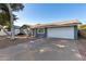 House exterior with a large driveway and front yard at 13428 N 36Th Pl, Phoenix, AZ 85032