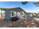 Single story home with gray exterior, landscaping, and a two-car garage at 13428 N 36Th Pl, Phoenix, AZ 85032