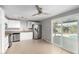 Bright kitchen with stainless steel appliances and white cabinets at 13428 N 36Th Pl, Phoenix, AZ 85032