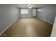 Spacious living room with tile flooring and neutral walls at 13428 N 36Th Pl, Phoenix, AZ 85032