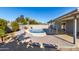 Inviting kidney-shaped pool with patio and covered area at 13428 N 36Th Pl, Phoenix, AZ 85032