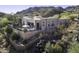 Aerial view showcasing the home's exterior and hilltop location; providing context to the landscape at 13767 N Prospect Trl, Fountain Hills, AZ 85268