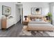 Modern bedroom with light wood furniture and plush carpet at 1433 E Kerry Ln, Phoenix, AZ 85024