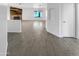 Bright entryway with wood-look tile floors and a view to living room at 1433 E Kerry Ln, Phoenix, AZ 85024