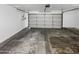 Attached garage with light-colored concrete floor at 1433 E Kerry Ln, Phoenix, AZ 85024