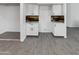 Modern kitchen with white cabinets and gray tile floors at 1433 E Kerry Ln, Phoenix, AZ 85024