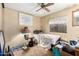 Cozy bedroom with window and ceiling fan at 1471 E 22Nd Ave, Apache Junction, AZ 85119