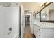 Bathroom with white vanity, tub and mirrored walls at 15550 N Frank Looyd Wright Blvd # 1057, Scottsdale, AZ 85260