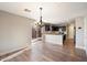 Bright dining room with hardwood floors and view into the kitchen at 15550 N Frank Looyd Wright Blvd # 1057, Scottsdale, AZ 85260