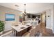 Bright dining area with a marble table and modern chandelier, open to the kitchen at 15550 N Frank Looyd Wright Blvd # 1057, Scottsdale, AZ 85260