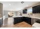 Modern kitchen featuring an island, dark cabinets, and stainless steel appliances at 15550 N Frank Looyd Wright Blvd # 1057, Scottsdale, AZ 85260