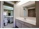 Clean bathroom with vanity, toilet, and access to another room at 16644 N 33Rd St # 105, Phoenix, AZ 85032