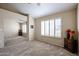 Spacious bedroom with mirrored closet doors and neutral carpeting at 16644 N 33Rd St # 105, Phoenix, AZ 85032