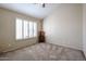 Bright bedroom with plantation shutters and neutral decor at 16644 N 33Rd St # 105, Phoenix, AZ 85032