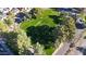 Aerial view of a community greenbelt with lush grass and mature trees at 16644 N 33Rd St # 105, Phoenix, AZ 85032