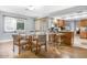 Bright dining area with glass table and four chairs at 17027 N 95Th Dr, Sun City, AZ 85373