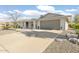 House exterior featuring a modern design and attached garage at 17027 N 95Th Dr, Sun City, AZ 85373