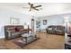 Bright living room with hardwood floors and comfortable seating at 17027 N 95Th Dr, Sun City, AZ 85373