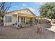 Home exterior showcasing a covered patio and spacious backyard at 17713 N Larkspur Ln, Surprise, AZ 85374