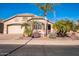 Single-story home with desert landscaping and two-car garage at 18056 W Buena Vista Dr, Surprise, AZ 85374