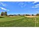 Scenic view of a lush green golf course and mountain backdrop at 18056 W Buena Vista Dr, Surprise, AZ 85374