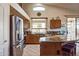 Spacious kitchen with granite countertops and stainless steel appliances at 18056 W Buena Vista Dr, Surprise, AZ 85374