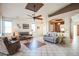 Bright living room with tile floors and comfortable seating at 18056 W Buena Vista Dr, Surprise, AZ 85374