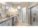 Elegant bathroom with granite countertop and walk-in shower at 18265 N 116Th Dr, Surprise, AZ 85378