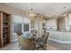 Cozy breakfast nook with glass table and wicker chairs near kitchen at 18265 N 116Th Dr, Surprise, AZ 85378