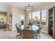 Bright breakfast nook with glass-top table and wicker chairs at 18265 N 116Th Dr, Surprise, AZ 85378