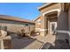 Charming front patio with seating area, perfect for relaxing at 18265 N 116Th Dr, Surprise, AZ 85378