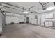 Large garage with storage cabinets and workshop area at 18265 N 116Th Dr, Surprise, AZ 85378