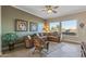 Living room with sectional sofa and ceiling fan at 18265 N 116Th Dr, Surprise, AZ 85378