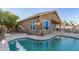 Large kidney shaped pool with surrounding patio at 18265 N 116Th Dr, Surprise, AZ 85378