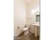 Clean and modern bathroom with pedestal sink and tile flooring at 1964 S Marble St, Gilbert, AZ 85295