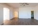 Bright bedroom featuring wood-look floors and access to hallway at 1964 S Marble St, Gilbert, AZ 85295